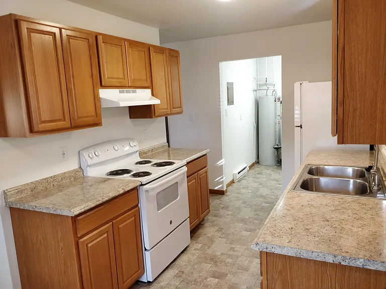 From dining area looking thru kitchen towards laundry.