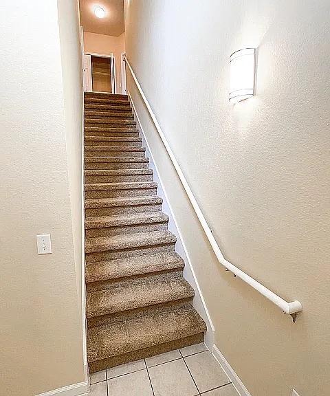 Entryway foyer and Stairs leading up to Apartment Entryway foyer and Stairs leading up to Apartment