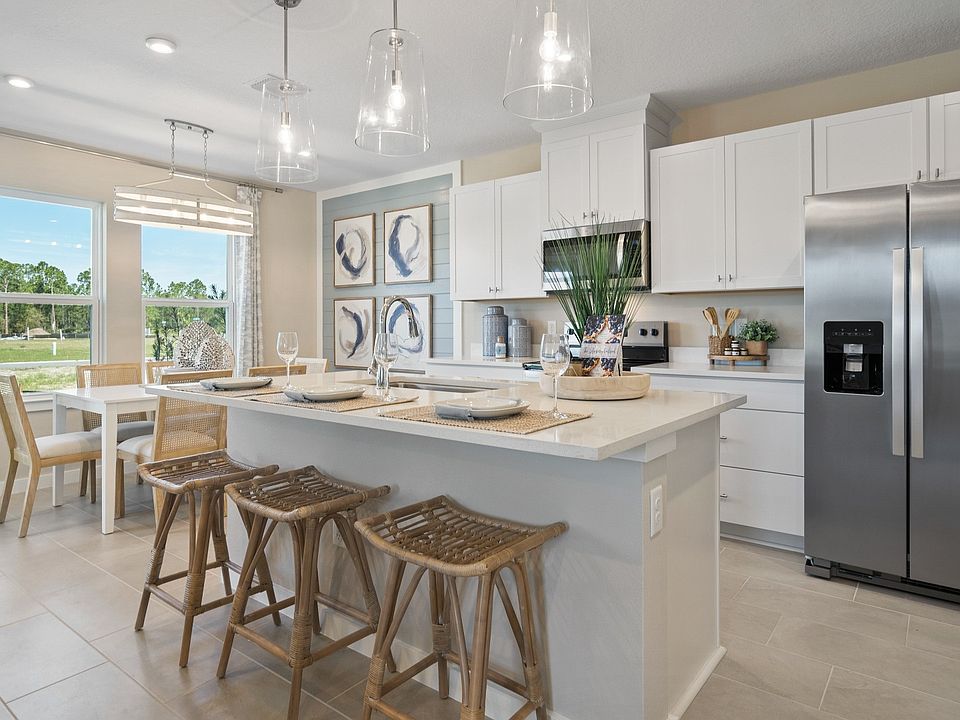 Cyrene at Harmony by DRB Homes in St. Cloud features an open kitchen and dining space for cooking an