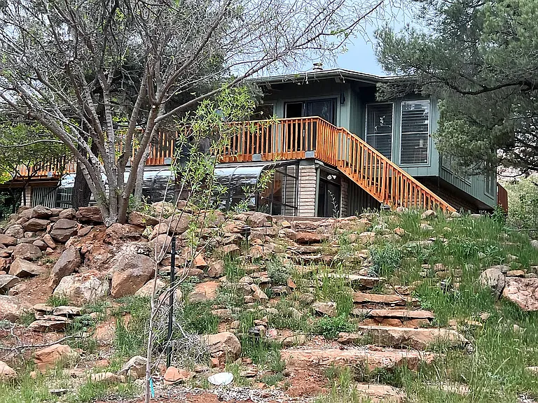 Elevated home on over an acre with expansive deck space