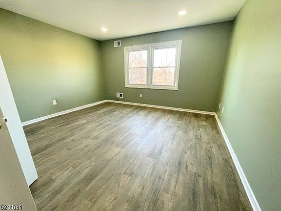 Large Bedroom with Newer Flooring and Paint!