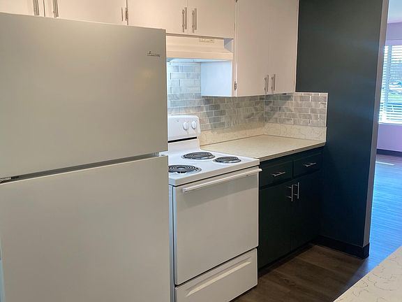 Kitchen with updated hardware. Fridge and stove provided
