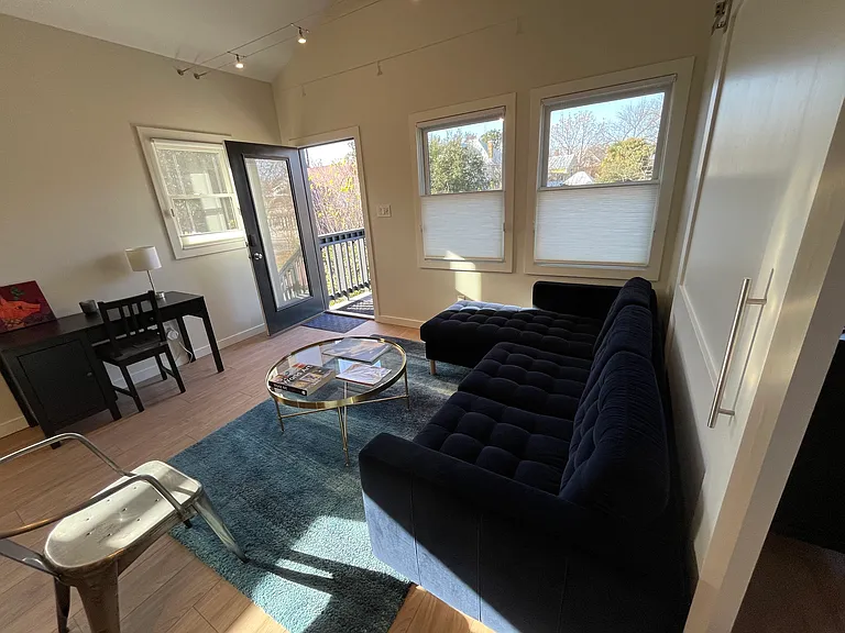 living area, door opens to top of stairs