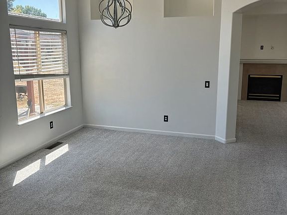 Dining area showing Fireplace adjacent to Kitchen