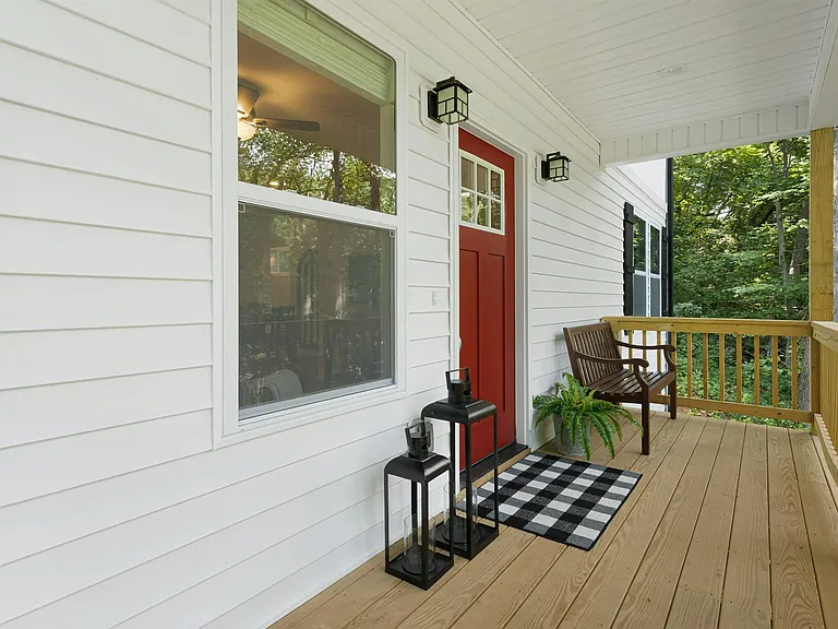 Inviting front porch elevated above main road