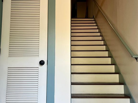 Foyer coat closet, entrance and staircase to main-living level.