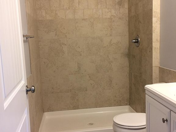 Master bathroom with tile shower & nice fixtures