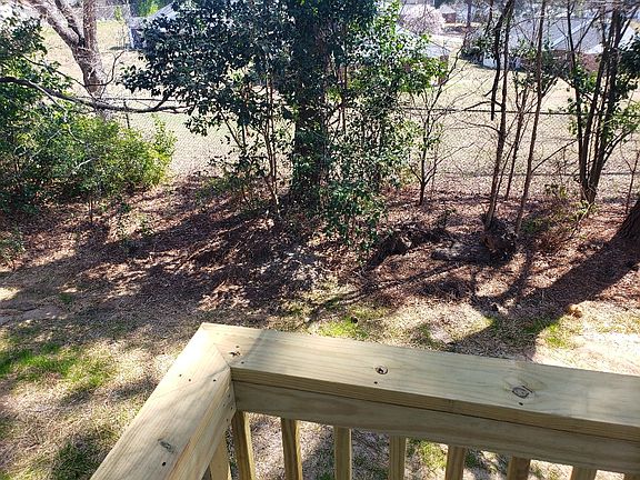 Rear yard. Partially fenced