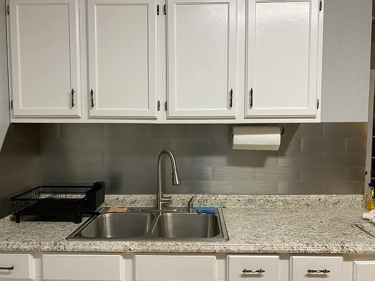 New countertop and faucet in kitchen