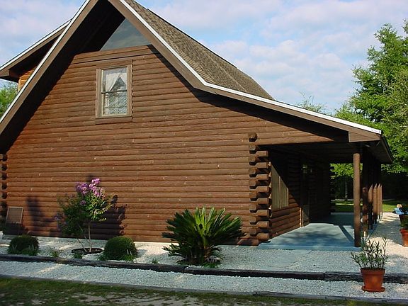 Priced To Sell.. Handcrafted Log Home w/ 5.4 acres. 30 min. to Destin Beaches