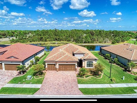 Three car air conditioned garage and lush established landscape.
