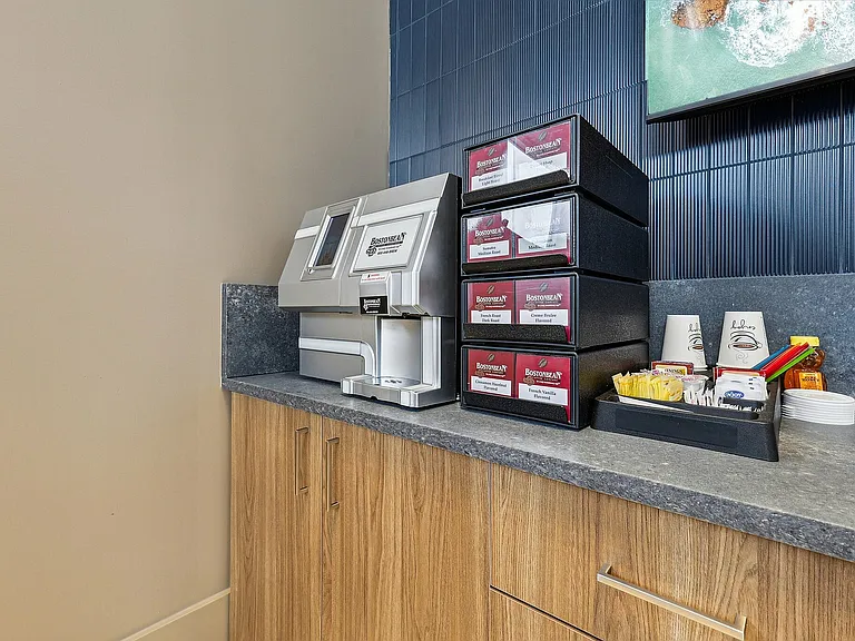 Indulge in a premium coffee experience at this elegant apartment lounge station.