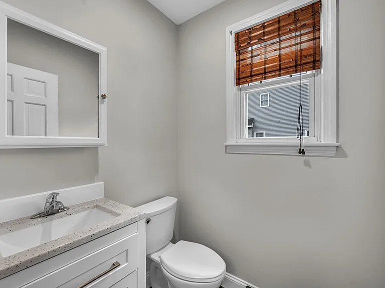Updated half bath on first floor off kitchen.