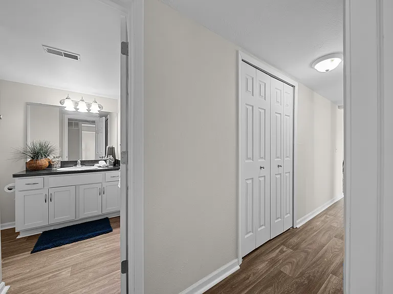 Posh bathroom with ample storage space at Three Oaks Apartments in Troy, Mi