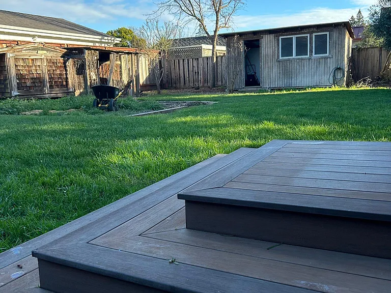 Garden area and garden shed in large backyard