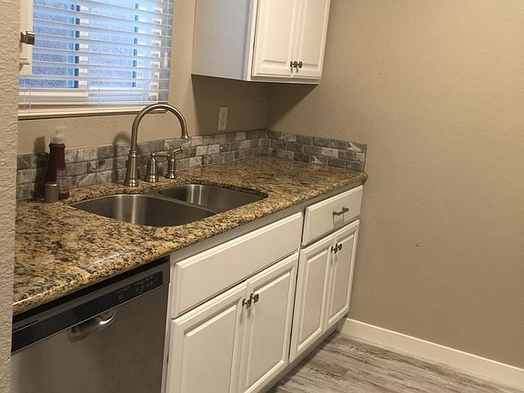 Kitchen with newer cabinets and dishwasher