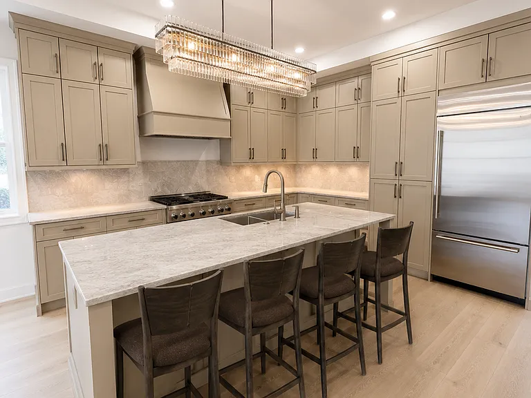 Chefs Kitchen- Taj Mahal counters & backsplash, 36" gas range and premium appliances.