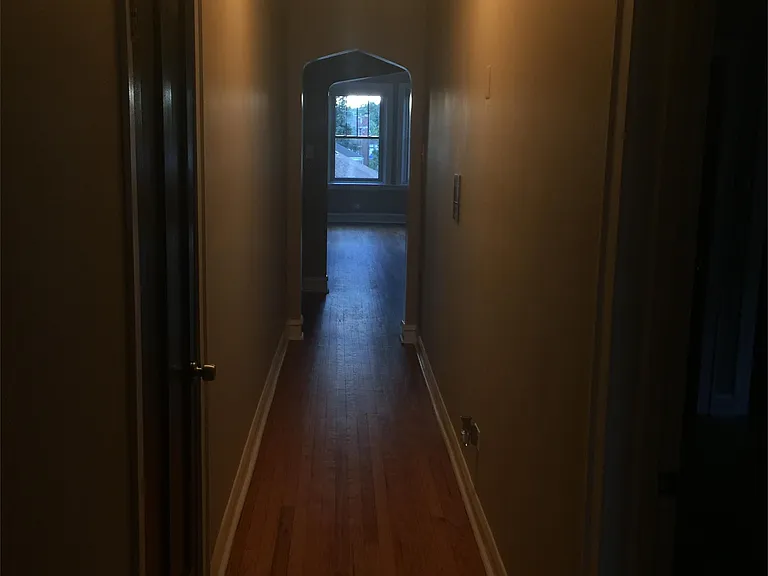 Elongated Hallway leading from living room to dining room