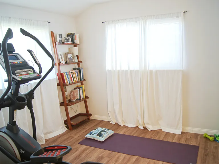 Bedroom 3 being used as an exercise room.