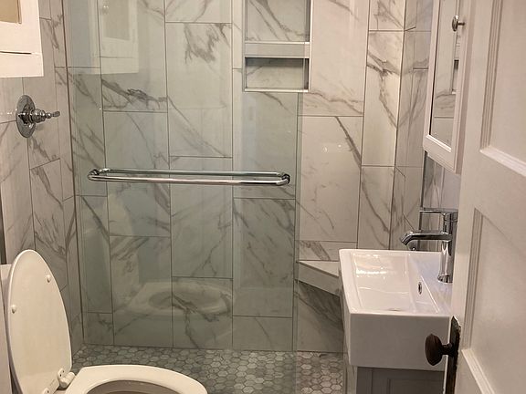 Bath with glassed in shower