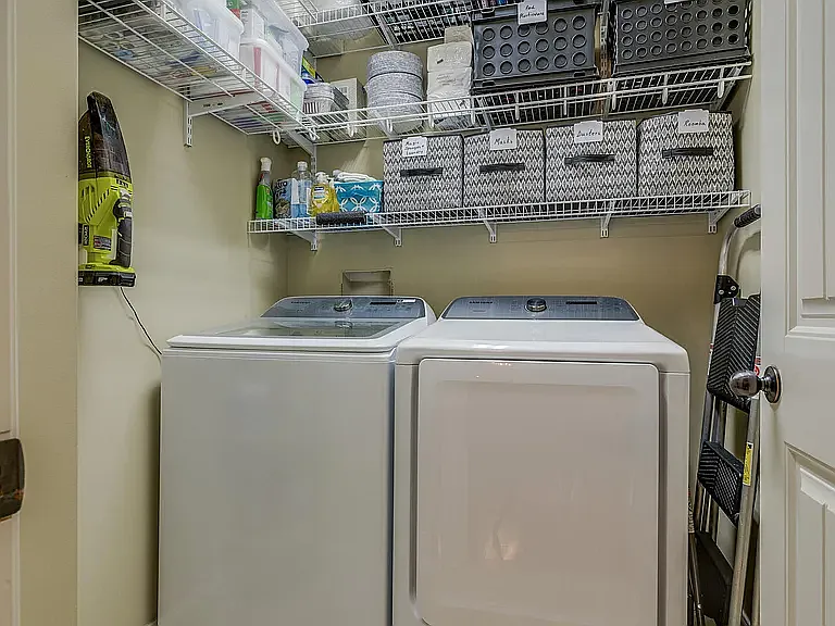 Separate Laundry Room with Samsung Washer & Dryer
