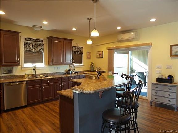 Beautiful kitchen with seating for six at the breakfast bar.