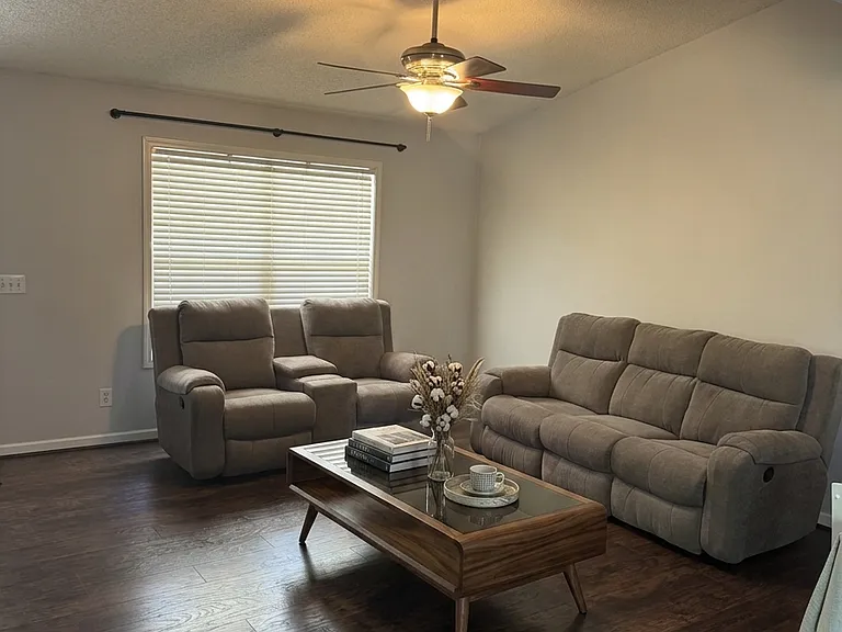 Comfortable living area with stylish seating and a warm, welcoming layout.