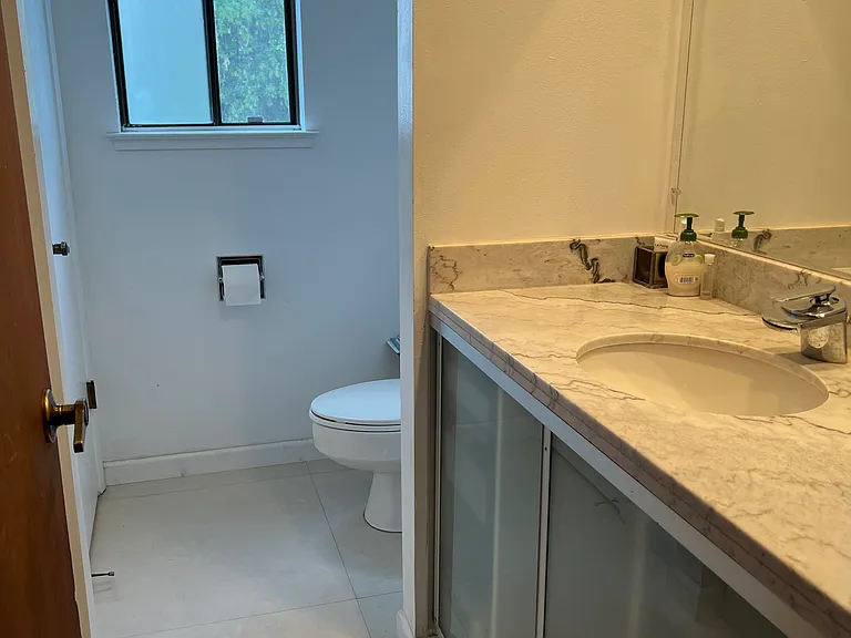 Upstairs toilet and sink on the right.