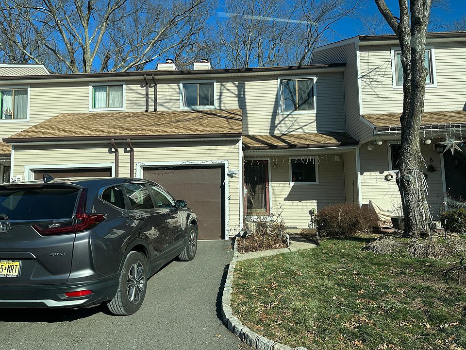 Front entry and small garden and walkway to house Vinyl siding Garage