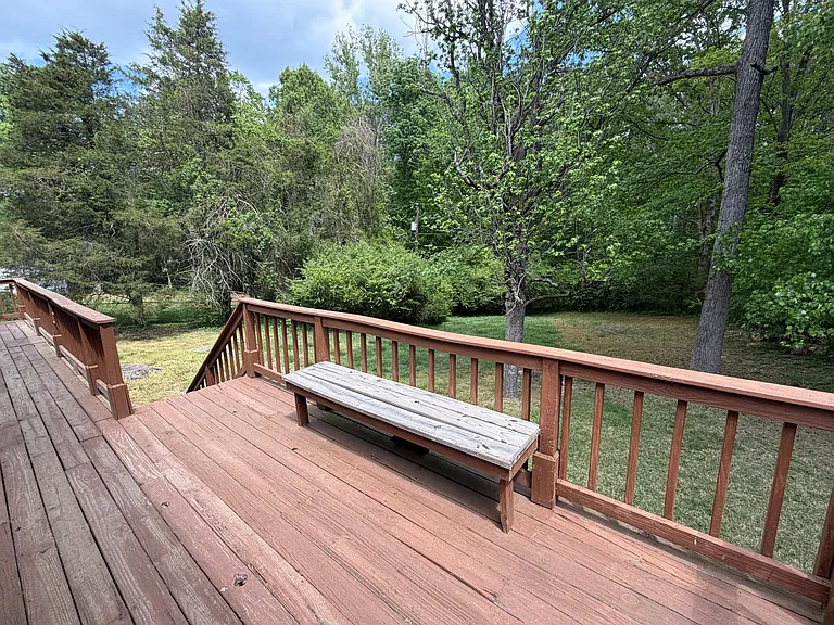 Rear deck overlooking a private backyard