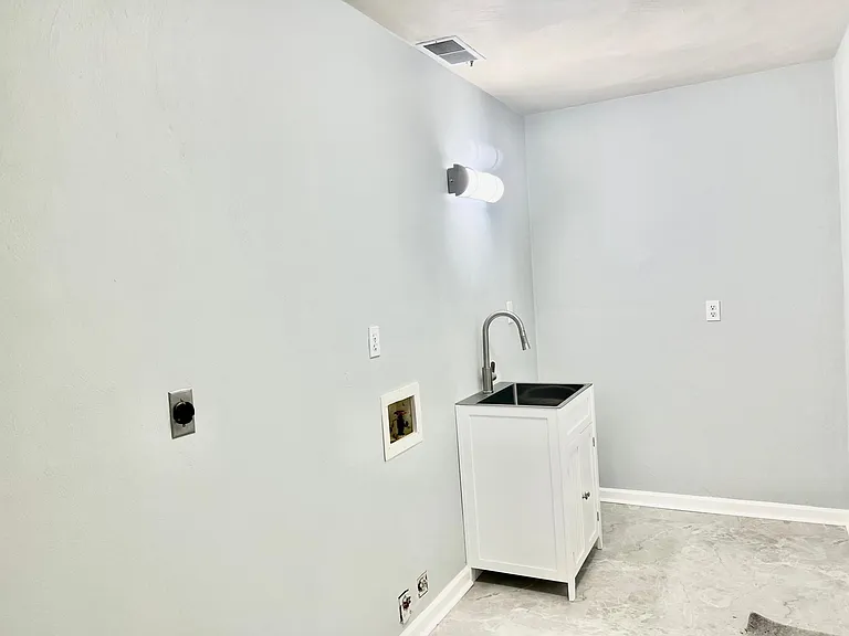 Laundry and Mud room off Kitchen going into the garage.