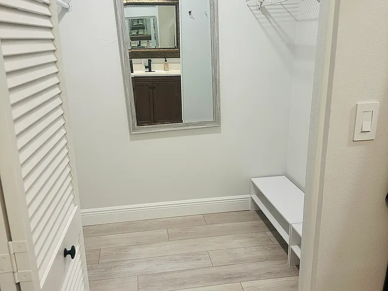 Primary suite large walk-in closet.
