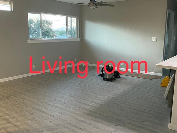 Living room with open space to the kitchen with quartz countertop.