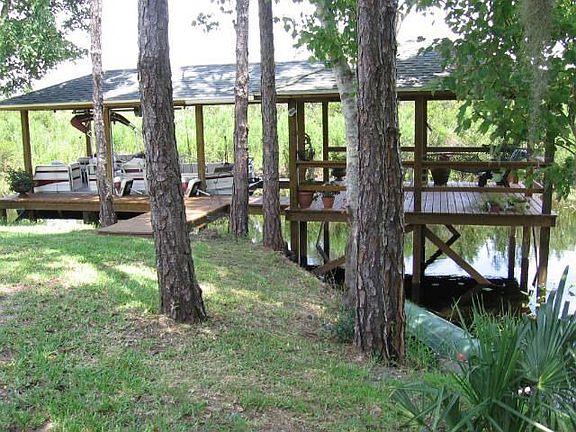 Boat dock behind home to Lake Monroe & St. Johns River