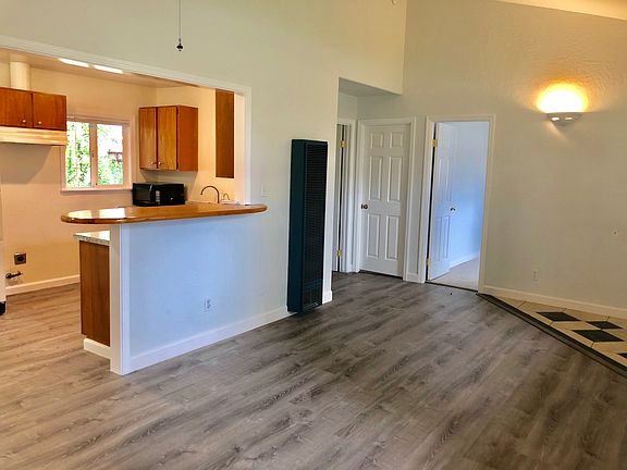 Living room view into kitchen and bedrooms