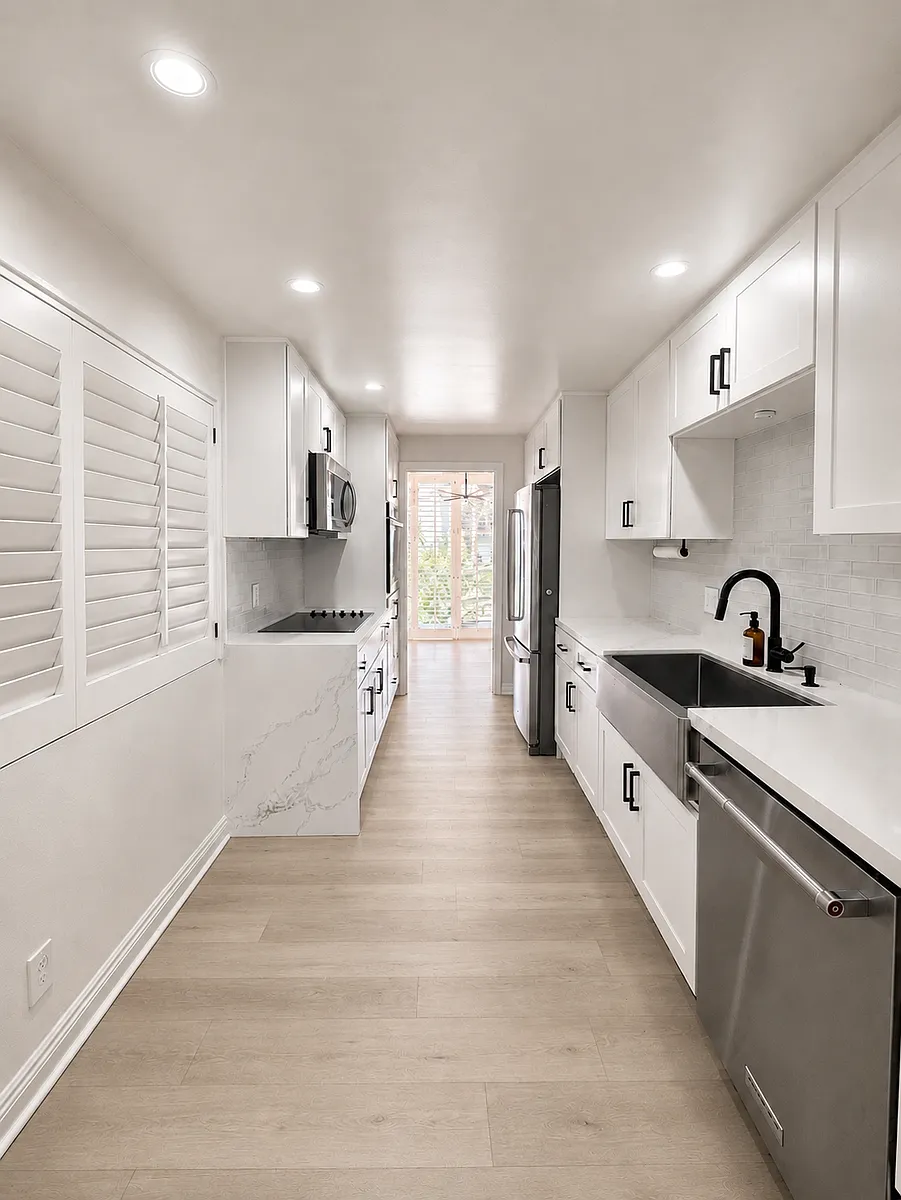 Galley kitchen view from front door/hallway entrance - 2100 E 2nd St #208