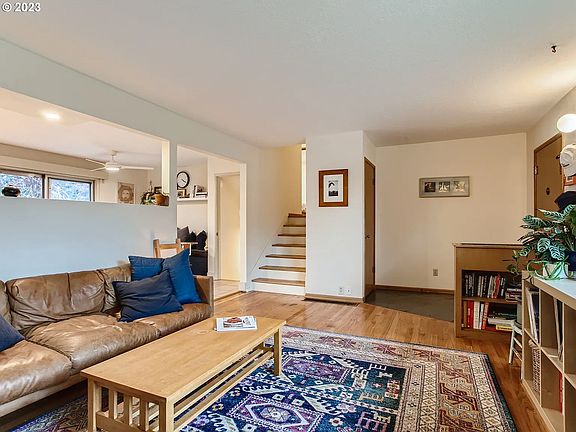 Front room with lots of light. Great for plant lovers and hosting.