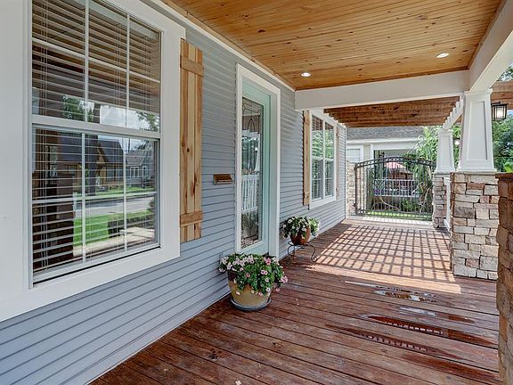 SPACIOUS FRONT PORCH ALLOWS AMPLE ROOM FOR OUTDOOR SEATING AND PLANTERS GALORE.