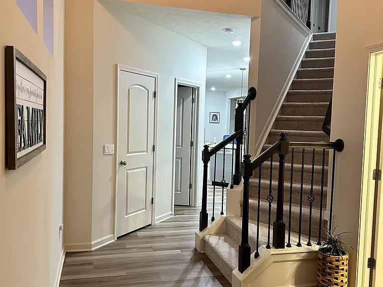 Grand foyer with high ceilings and elegant modern lighting