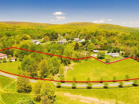Lovely 6.28 acres w/ stream along back wooded edge