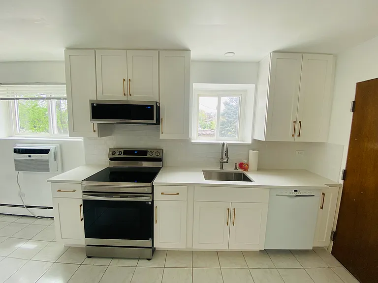 New kitchen cabinets and high-end appliances and finishes. Bright and sunny.