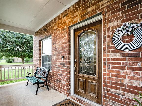 The mahogany door with leaded glass welcome you in - or simply enjoy relaxing on the lovely front porch.