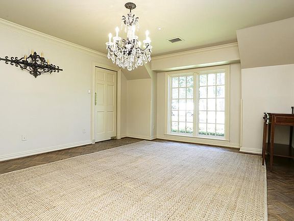 Generous size formal dining room with views to front yard and convenient swing door with access to k