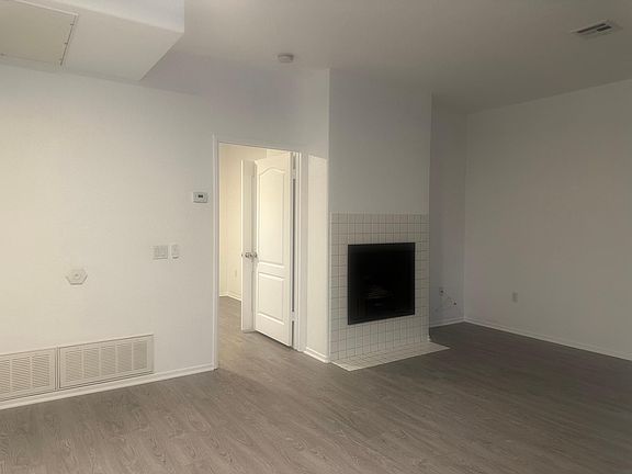Built in Fireplace in the living room with lots of natural light.