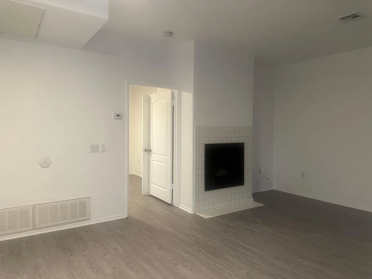 Built in Fireplace in the living room with lots of natural light. - 3602 Bernwood Pl #8