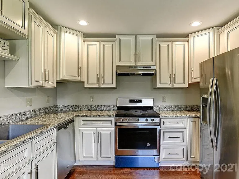 Granite countertops. Custom cabinets. Large fridge. Gas stove. Ceramic sink.