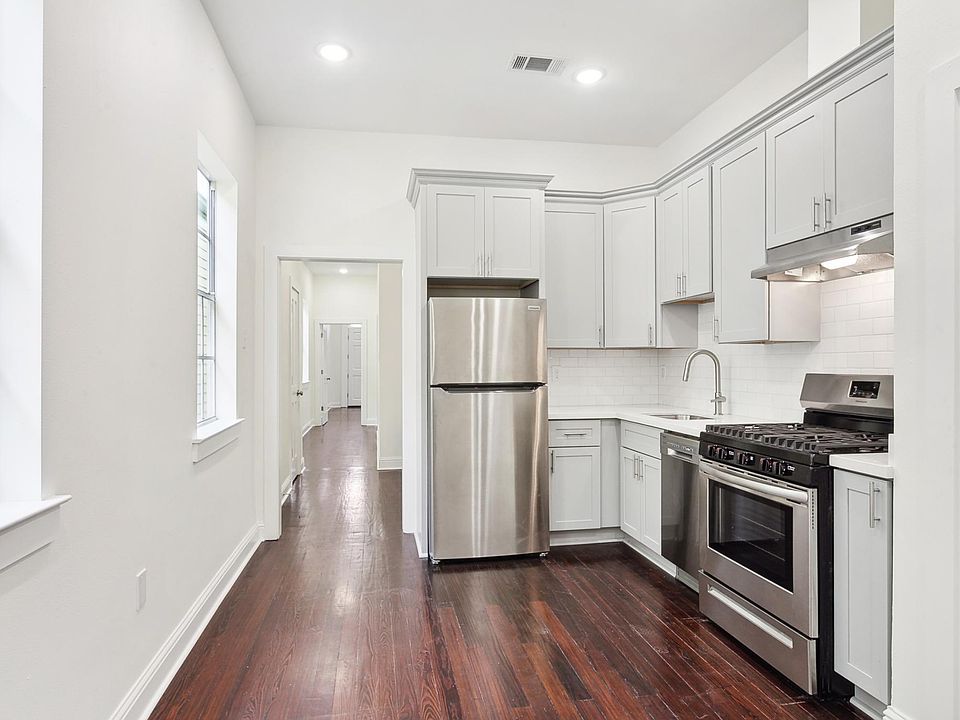 Kitchen with new stainless steel appliance and gas range