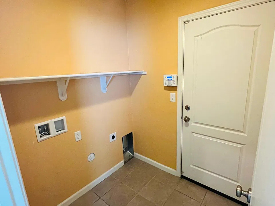 Laundry room. Door to the garage. 1st floor
