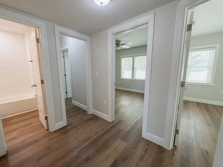 Hallway for the bedroom 1 and 2 with 1st bathroom.