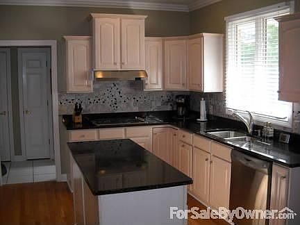 Newly updated kitchen : Granite counters, stainless appliances and beautiful backsplash